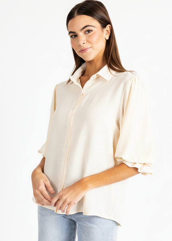 Yana K KESH TOP poly in a vibrant color, featuring a stylish design and lightweight fabric, perfect for casual wear.