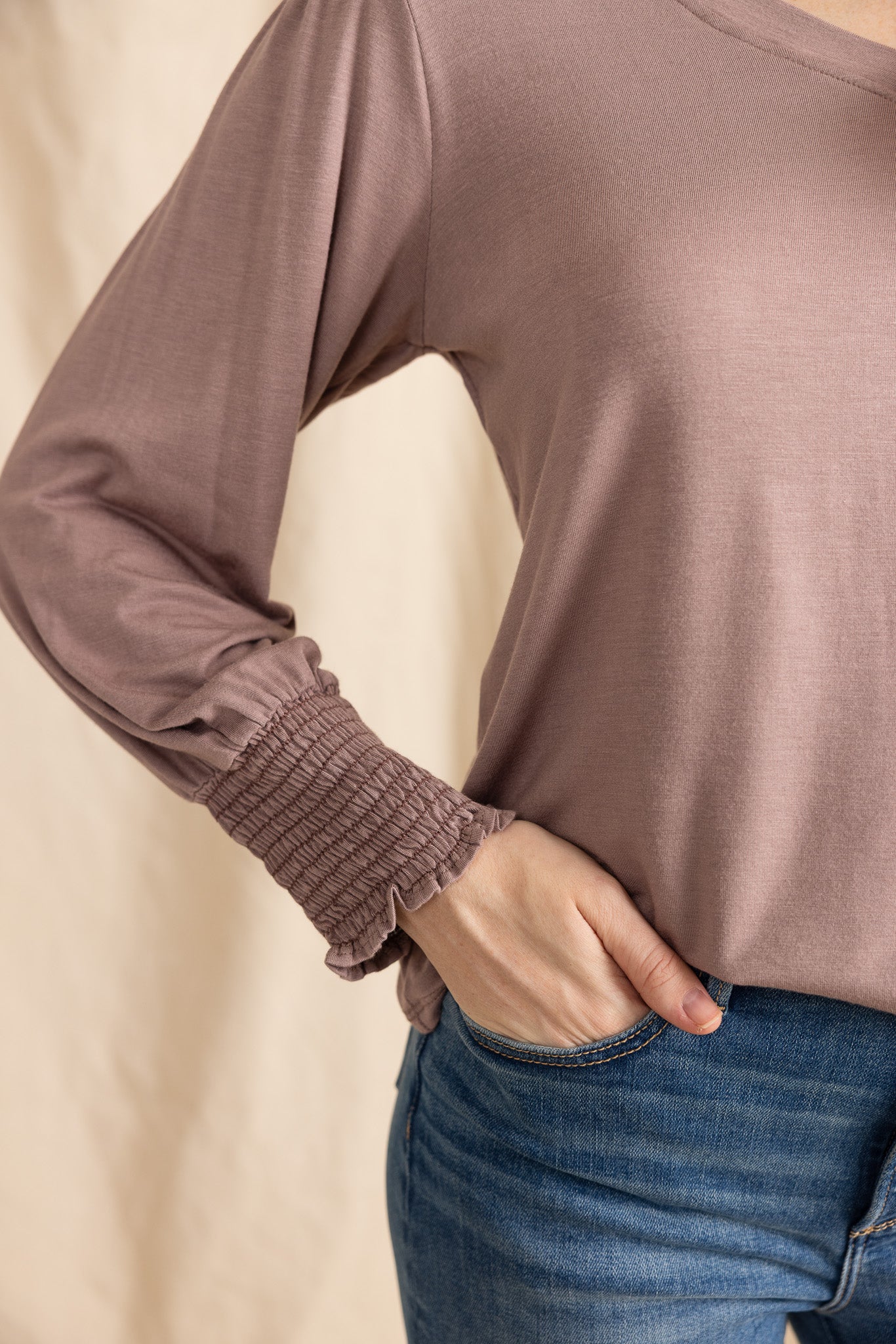 YanaK POLLY top in soft fabric, featuring a relaxed fit and elegant neckline, perfect for casual or dressy occasions.