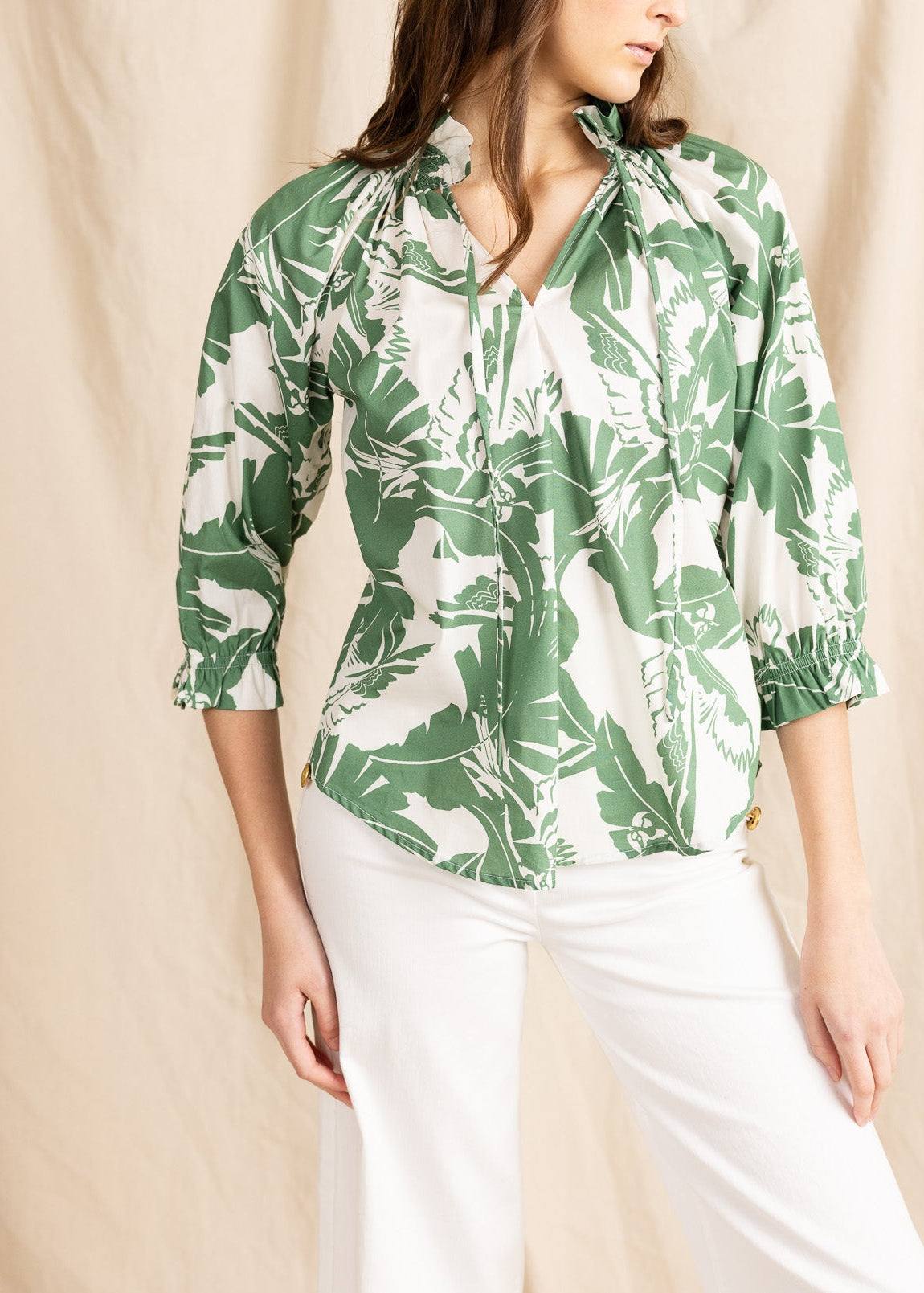 YanaK BELMONT blouse featuring a vibrant print, showcasing a stylish top with short sleeves and a flowy design.