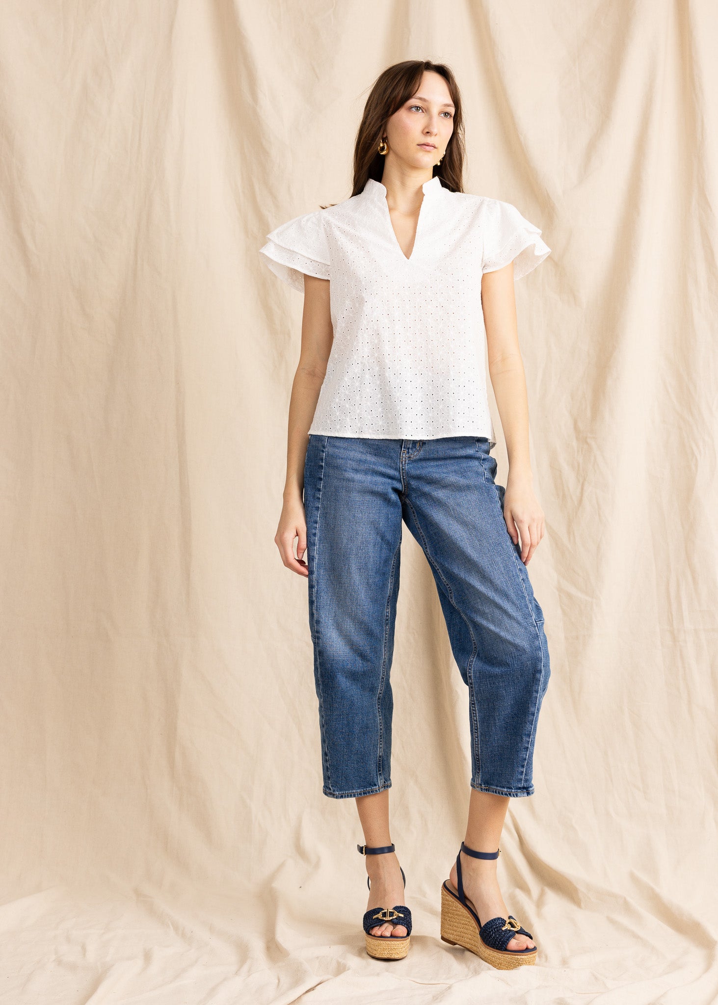 Yana K georgette top featuring intricate eyelet detailing in a flowing design, perfect for a stylish casual look.