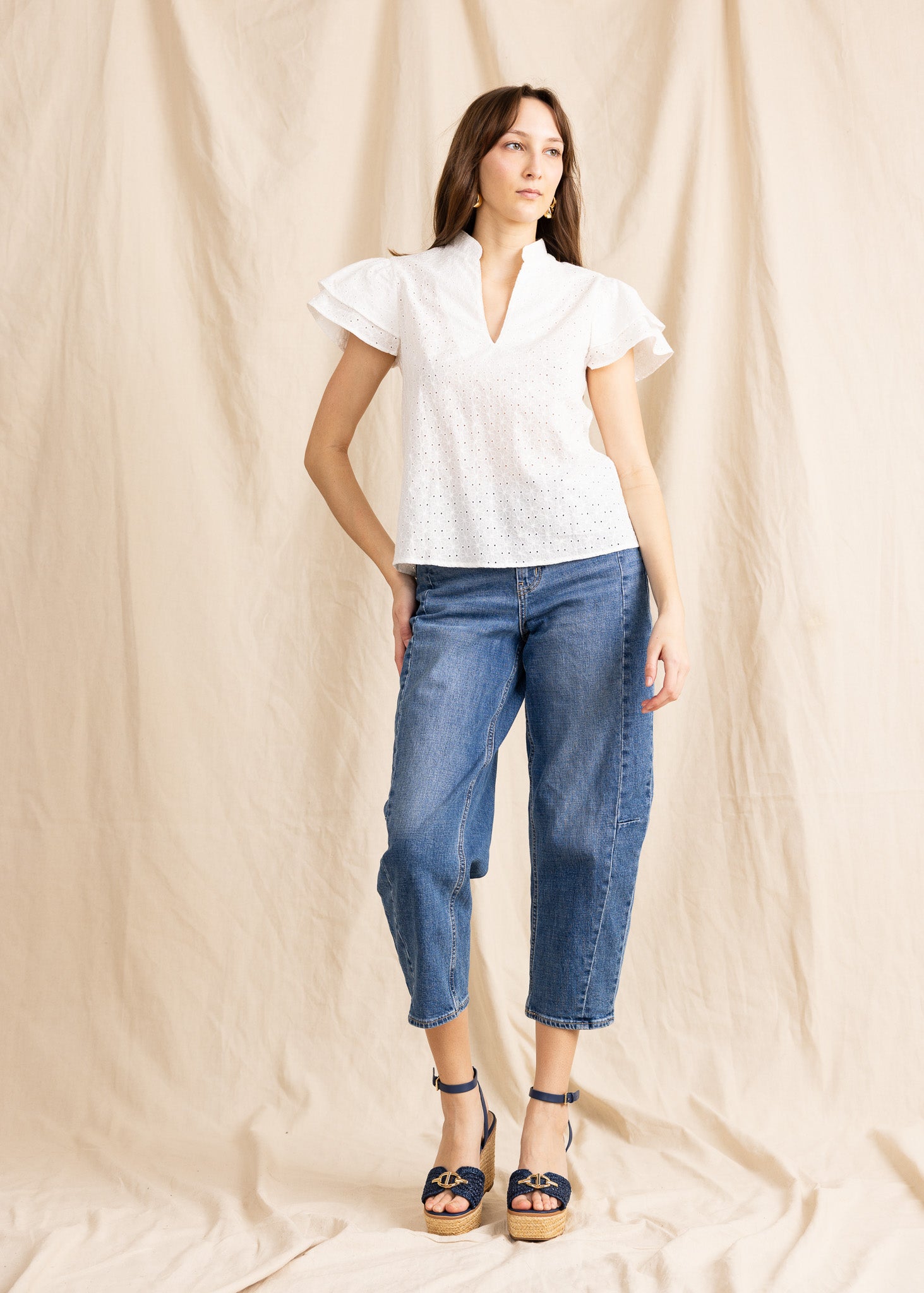 Yana K georgette top featuring delicate eyelet details and a flowing silhouette in soft fabric.