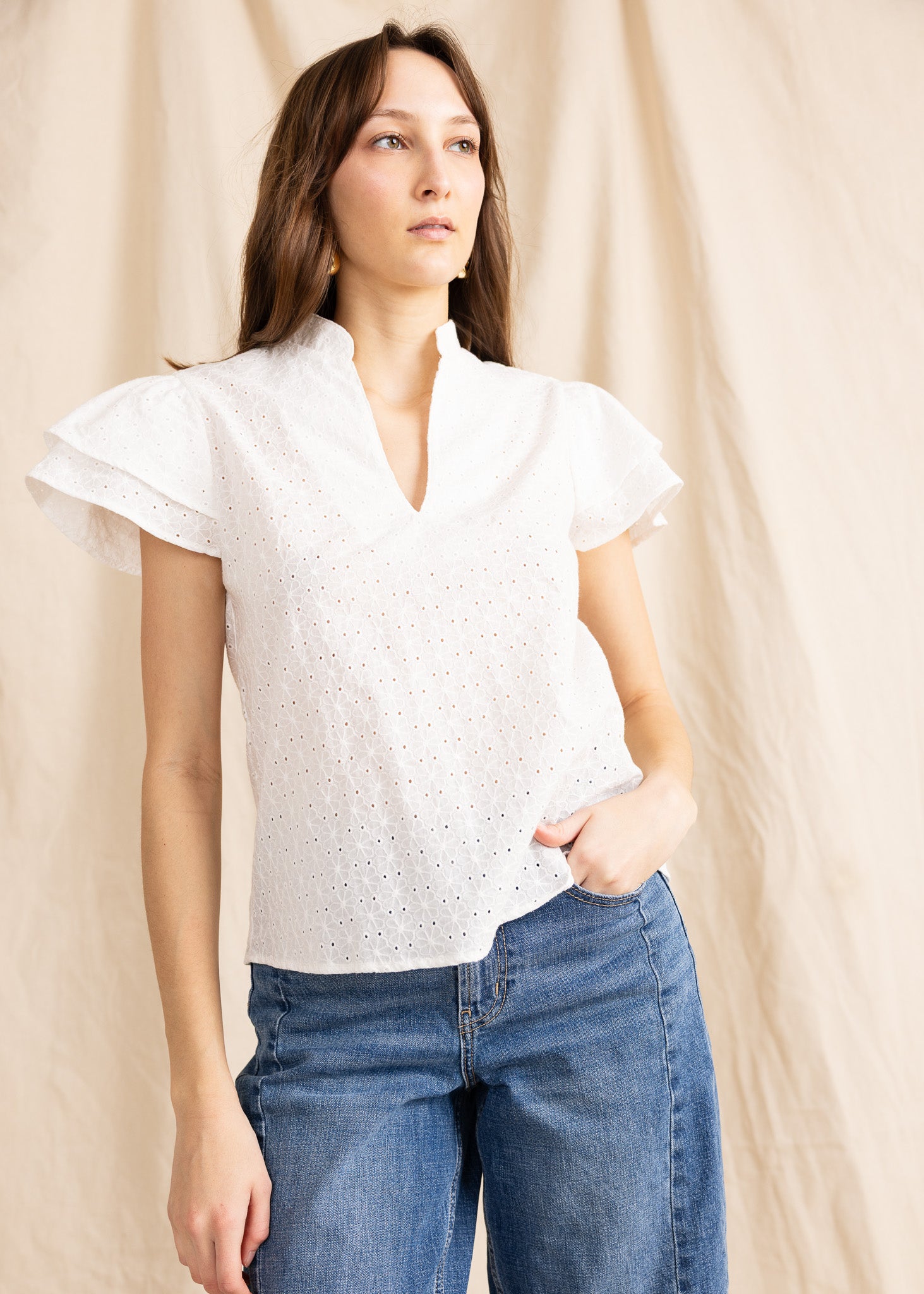Yana K georgette top featuring intricate eyelet details in a soft, flowing design.