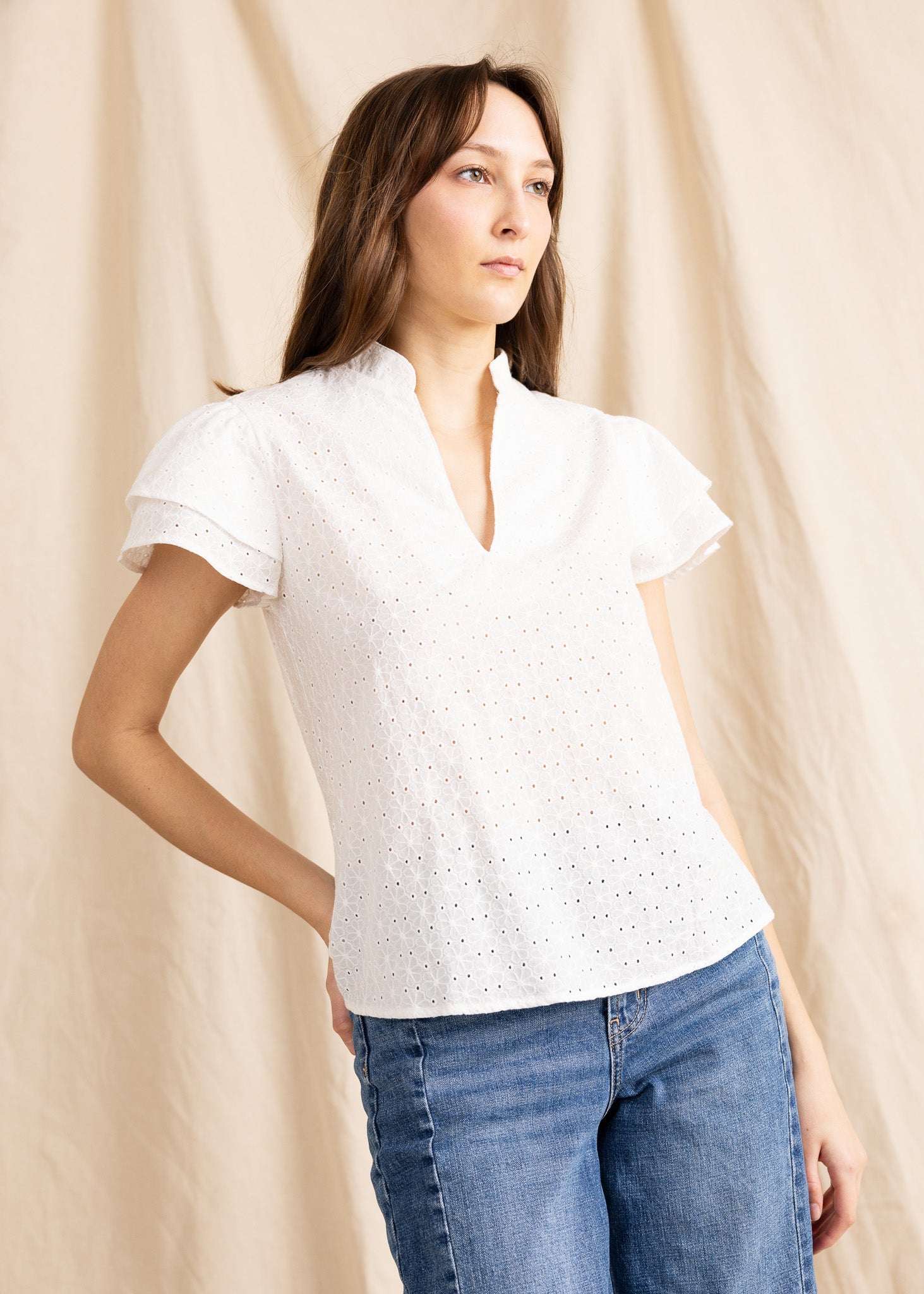 Yana K georgette top featuring intricate eyelet detailing in a soft fabric, perfect for casual or dressy occasions.