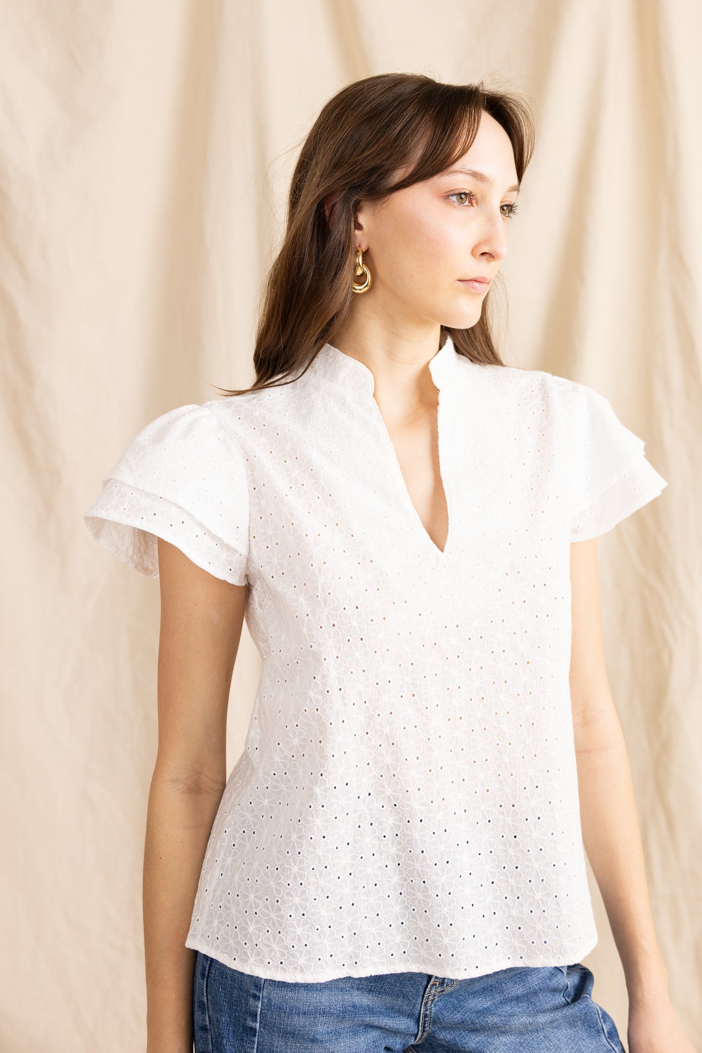 Yana K georgette top featuring eyelet details in a light, flowy fabric with a stylish design.