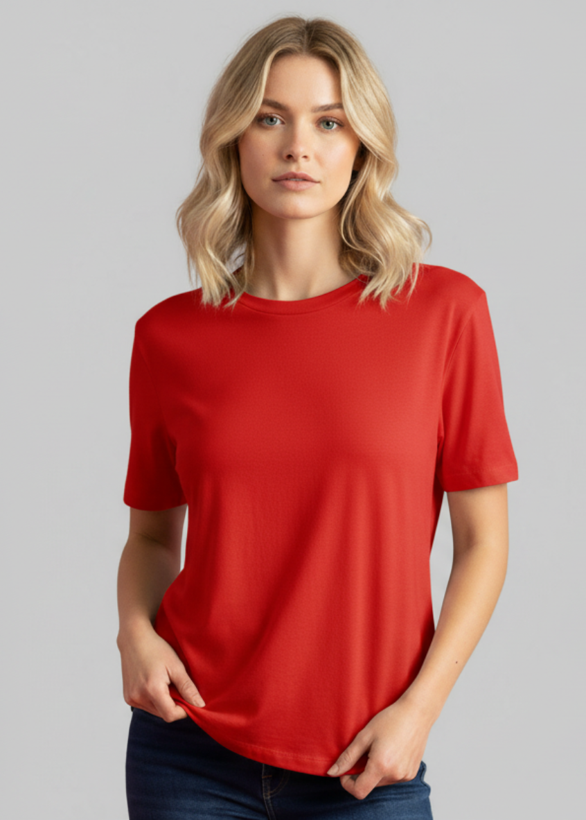 Woman wearing a red t-shirt against a gray background
