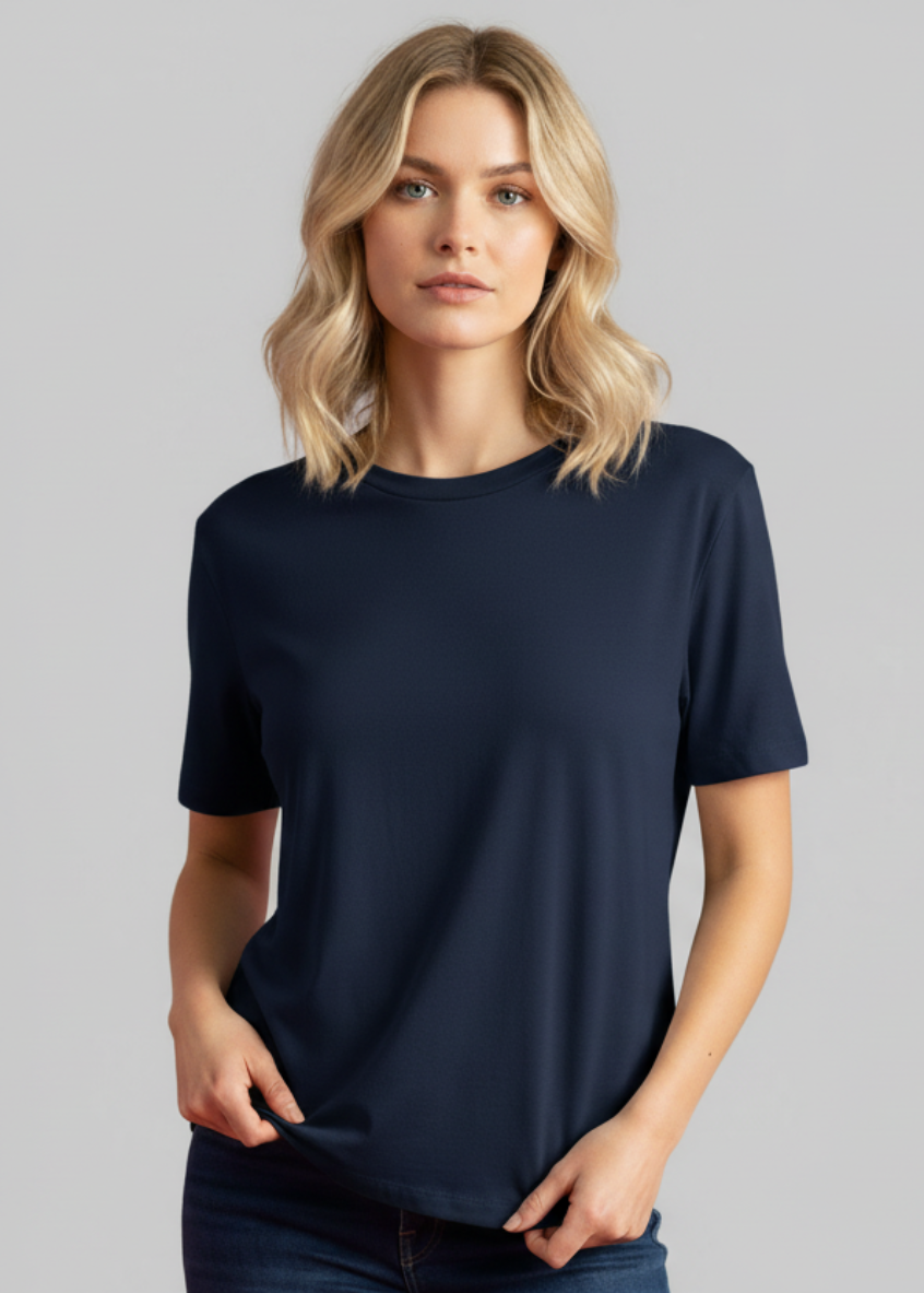 Woman wearing a navy blue t-shirt against a gray background