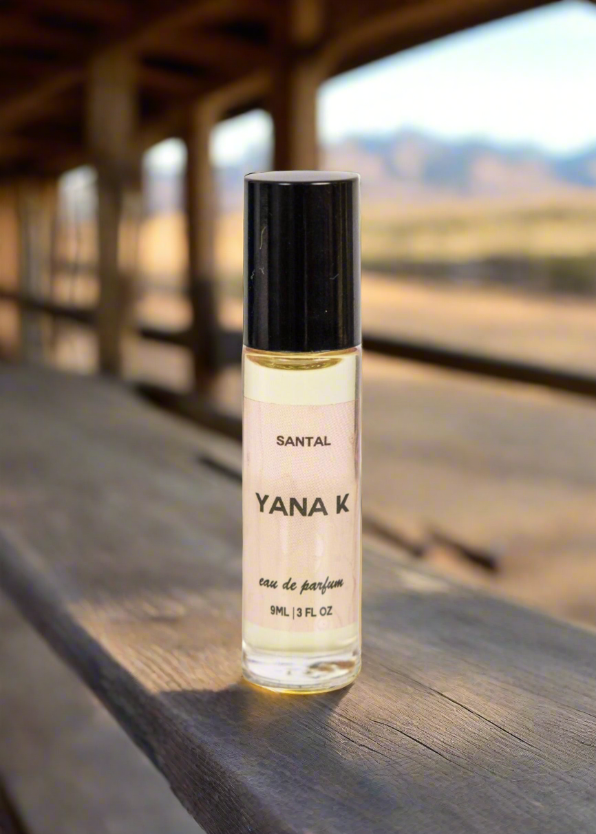 Yana K EAU DE PARFUM - SANTAL bottle with elegant design, showcasing its rich, earthy scent in a stylish glass container.