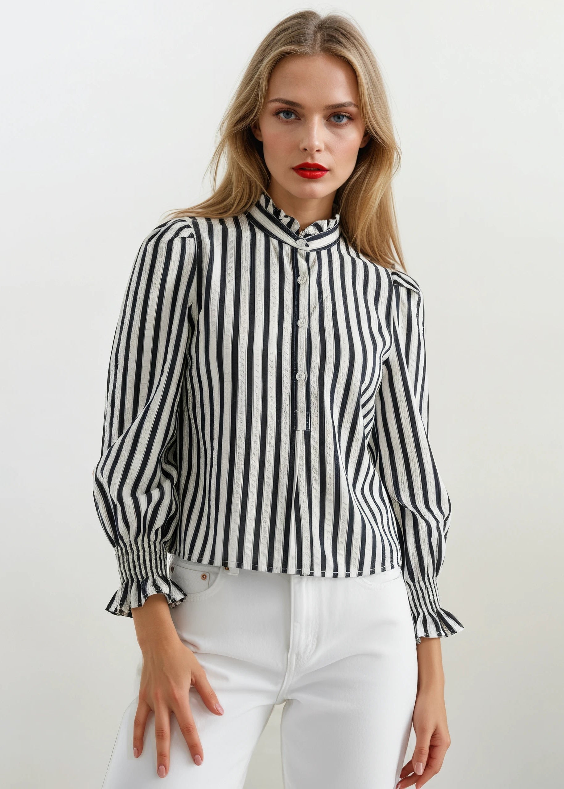 Woman wearing a black and white striped shirt against a white background